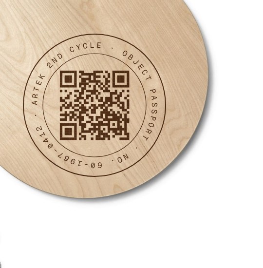 Laser-etched seal with QR code on the birch seat of a Stool 60